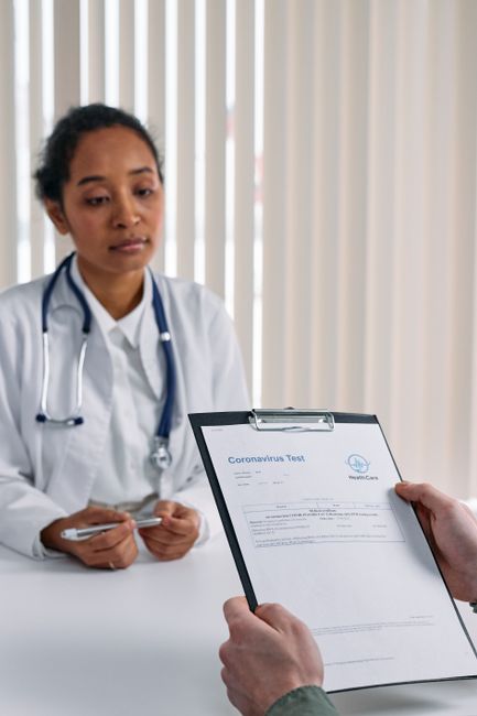 doctor explaining health checkup blood test results