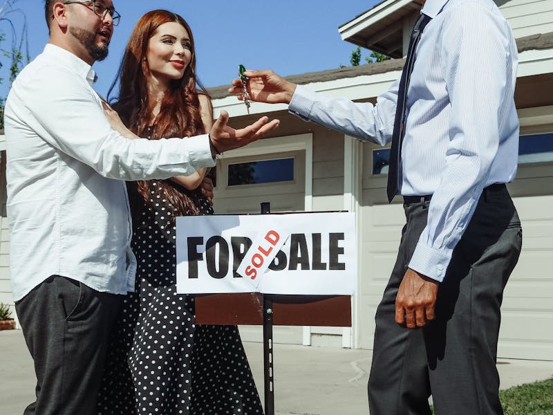 Young couple receiving keys to their first home in the Antelope Valley — Palmdale and Lancaster first-time buyers
