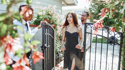 Couple Going Inside a Gate