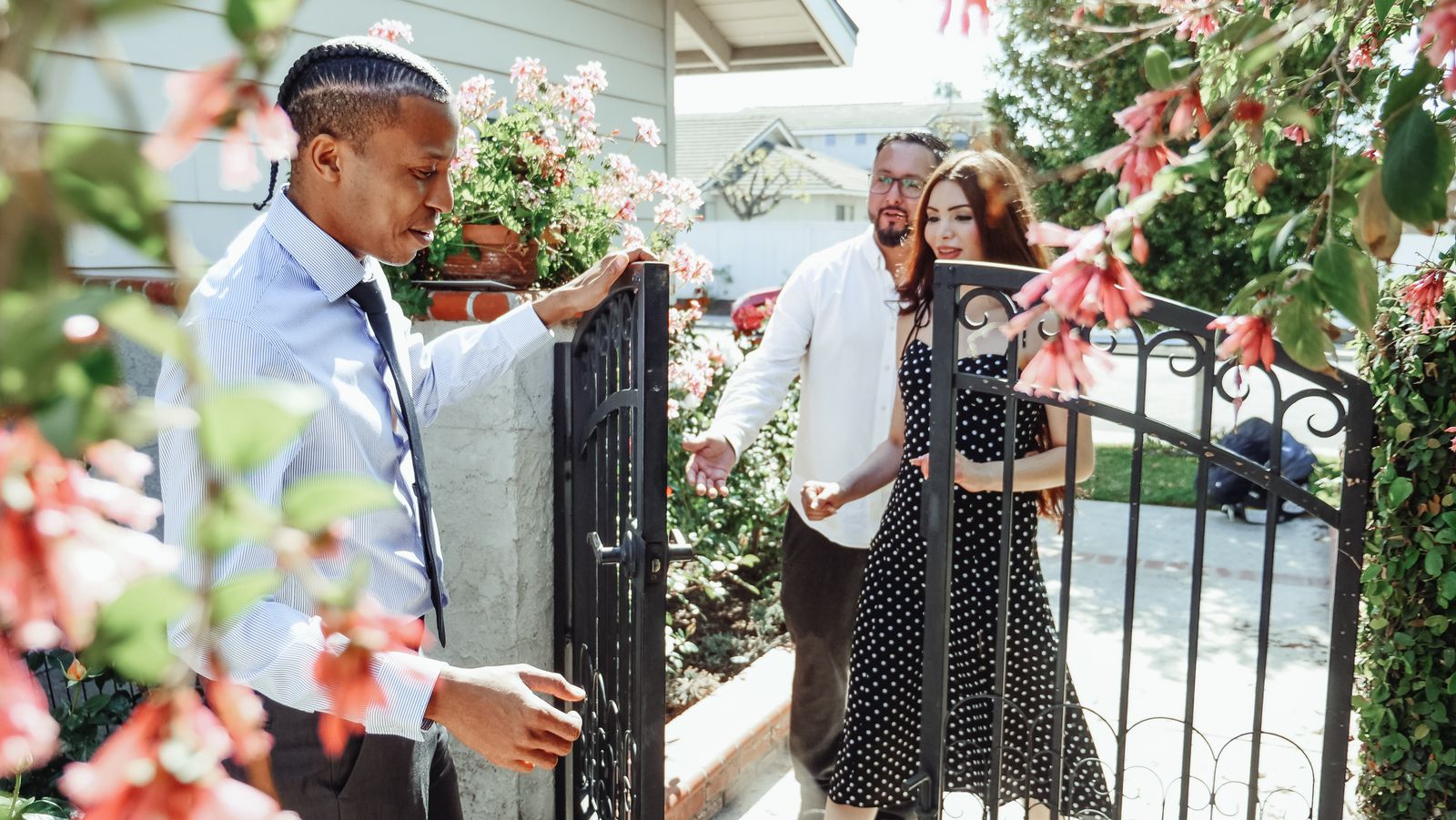 Property professional welcoming prospective residents to a home