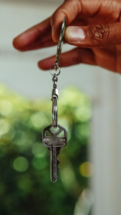 Free Person Holding a Key Stock Photo