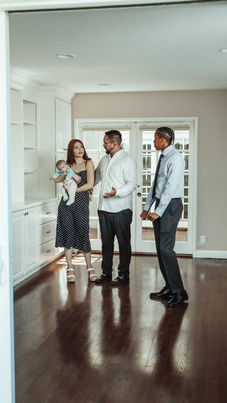 Family Looking At A House