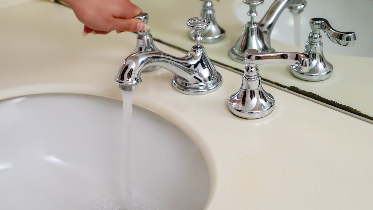 Free Water Flowing from a Faucet Stock Photo