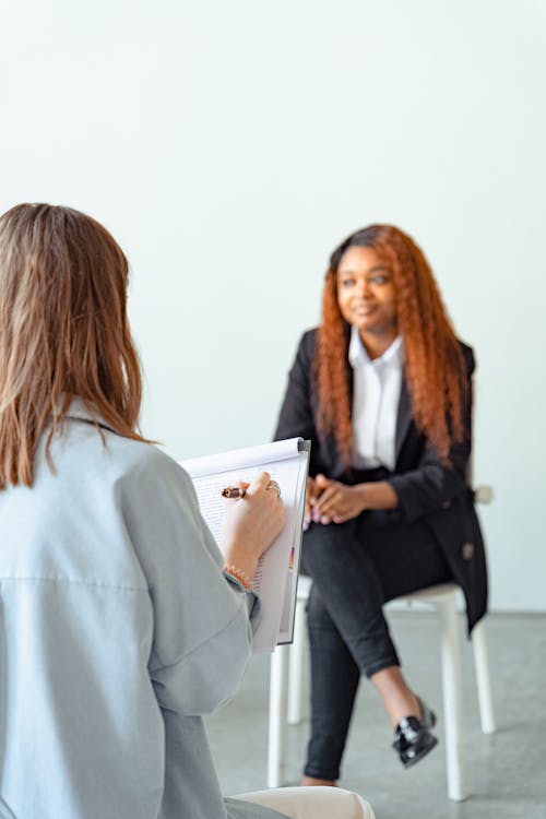 Free A Psychologist Giving Psychotherapy Session Stock Photo