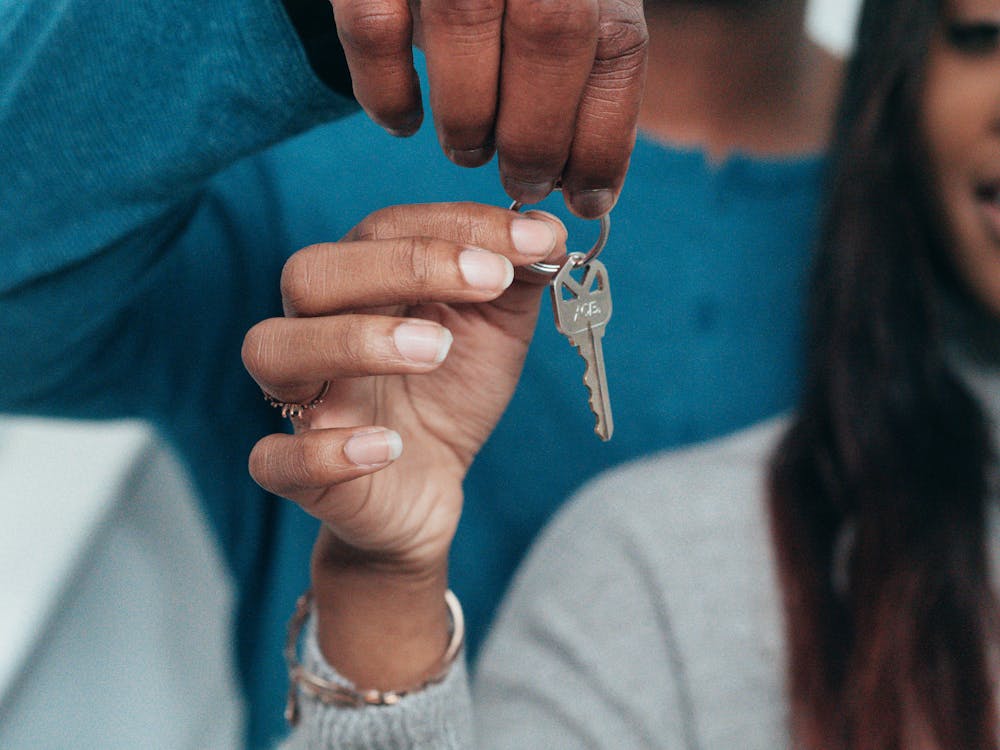 Free People Holding a Key Stock Photo
