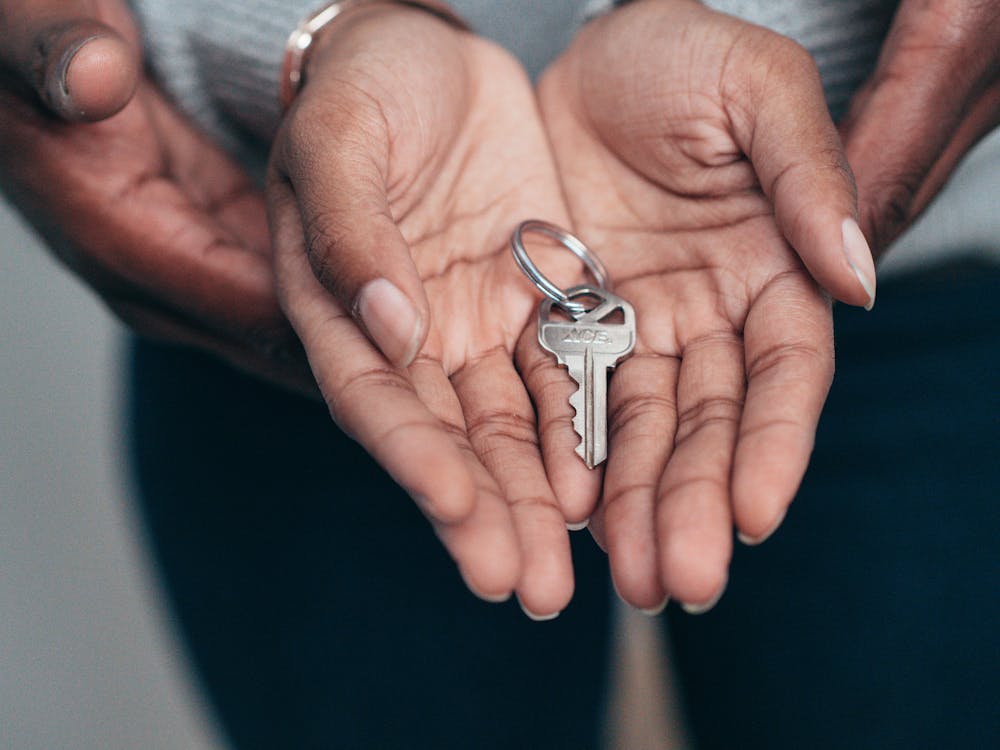 Free Key on a Person's Palm Stock Photo