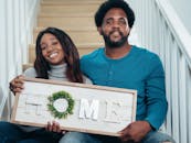 Man in Blue Long Sleeve Shirt Sitting Beside a Woman