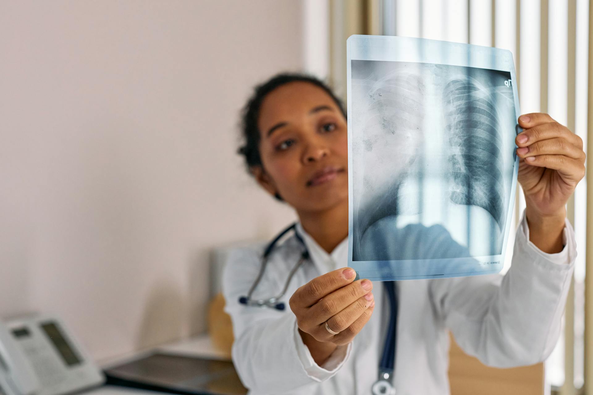 Doctor Looking at an X-ray Image of Lungs