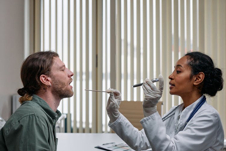 Doctor And Patient During Examination