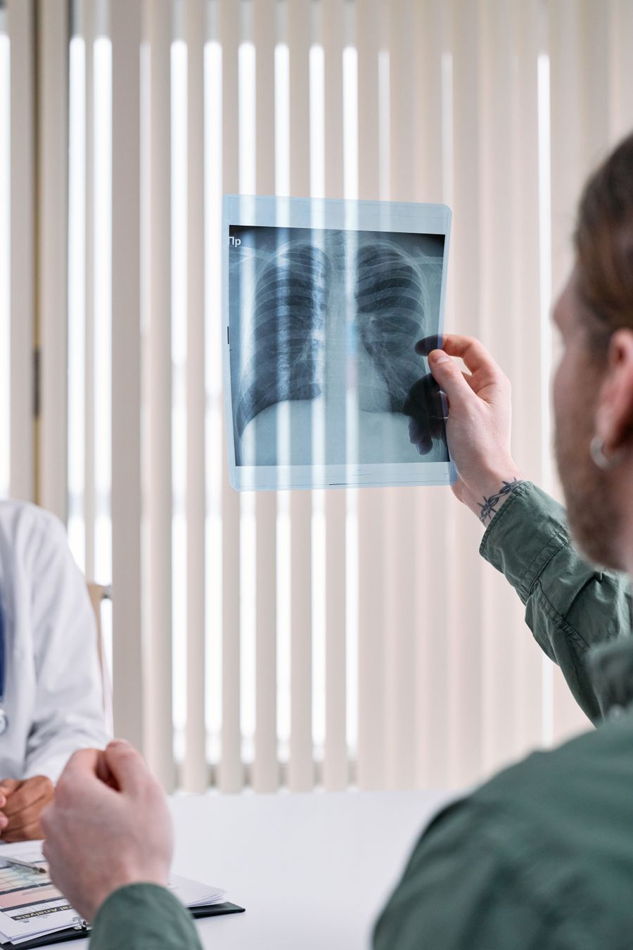 Radiologist holding an X-ray film