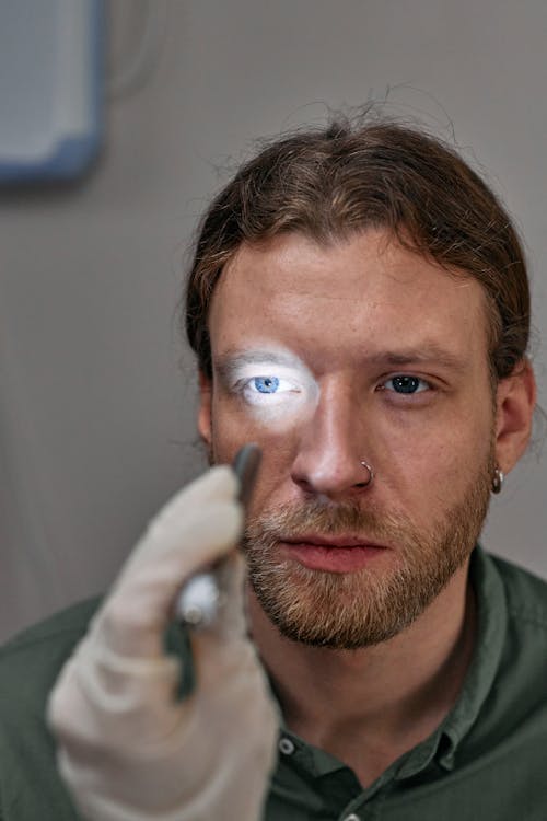 Man Getting His Eyes Checked by a Doctor 