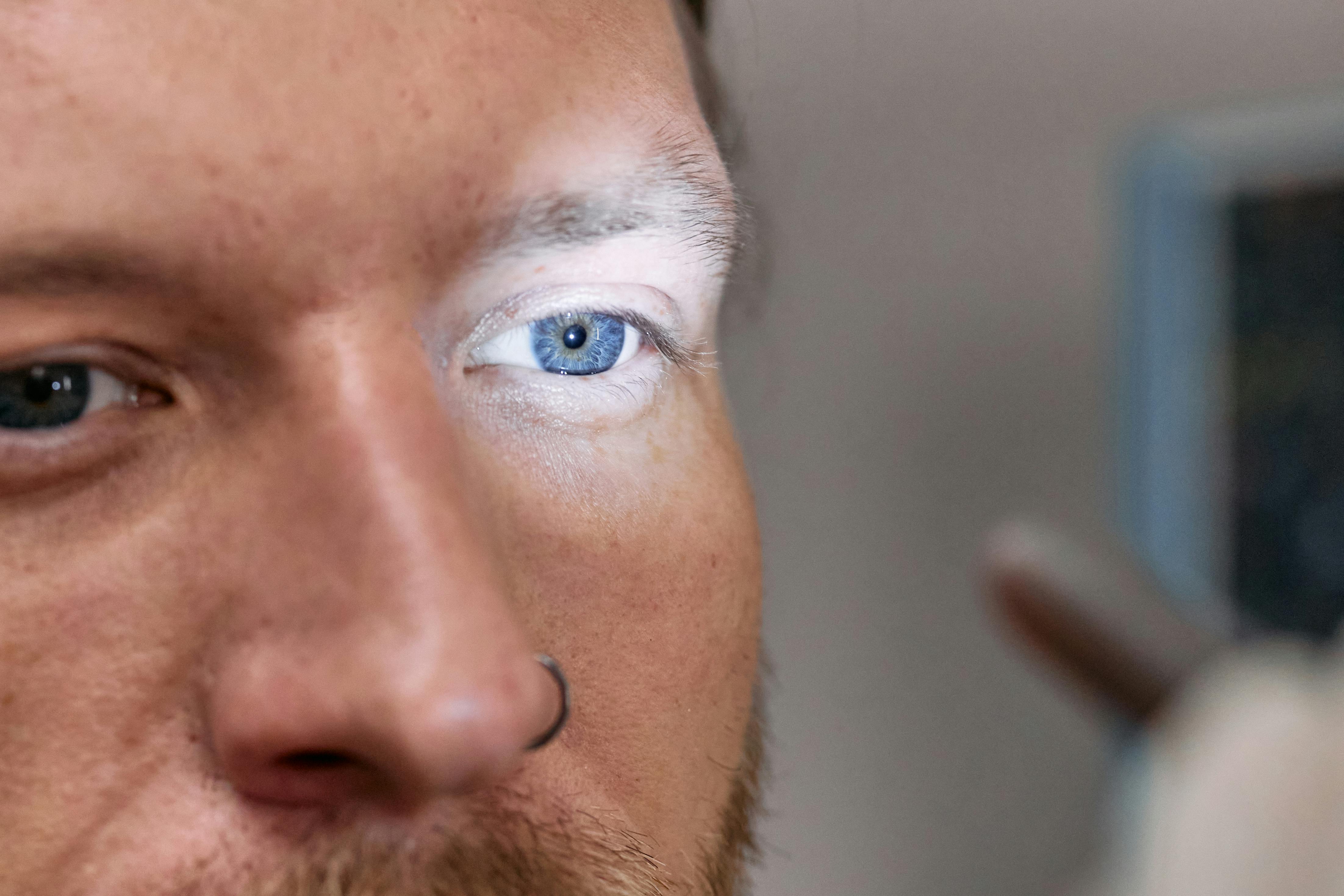 Close-up Shot Of Man's Eye. Man With Blue Eyes. Stock Photo