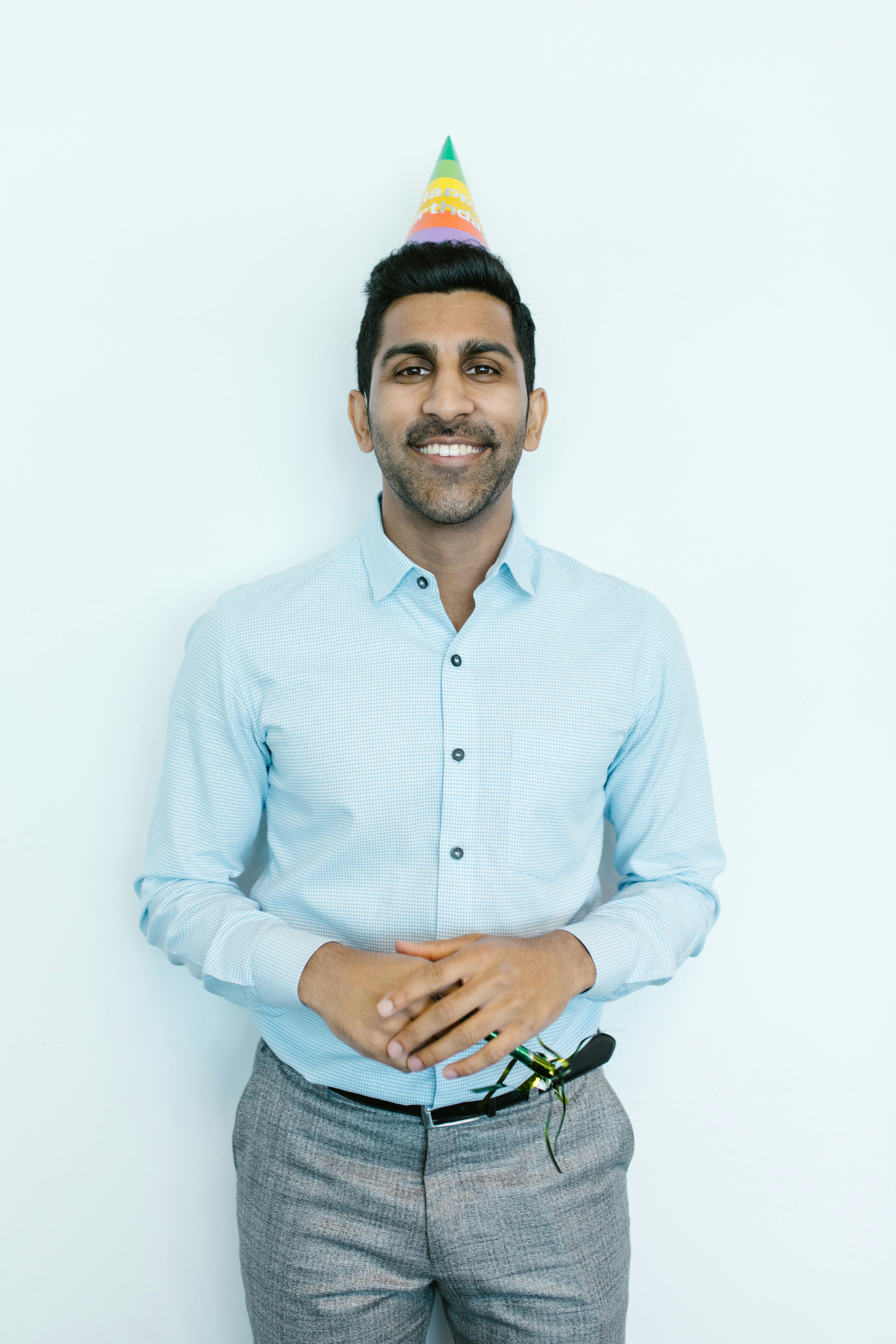 Man in Blue Dress Shirt and Blue Denim Jeans