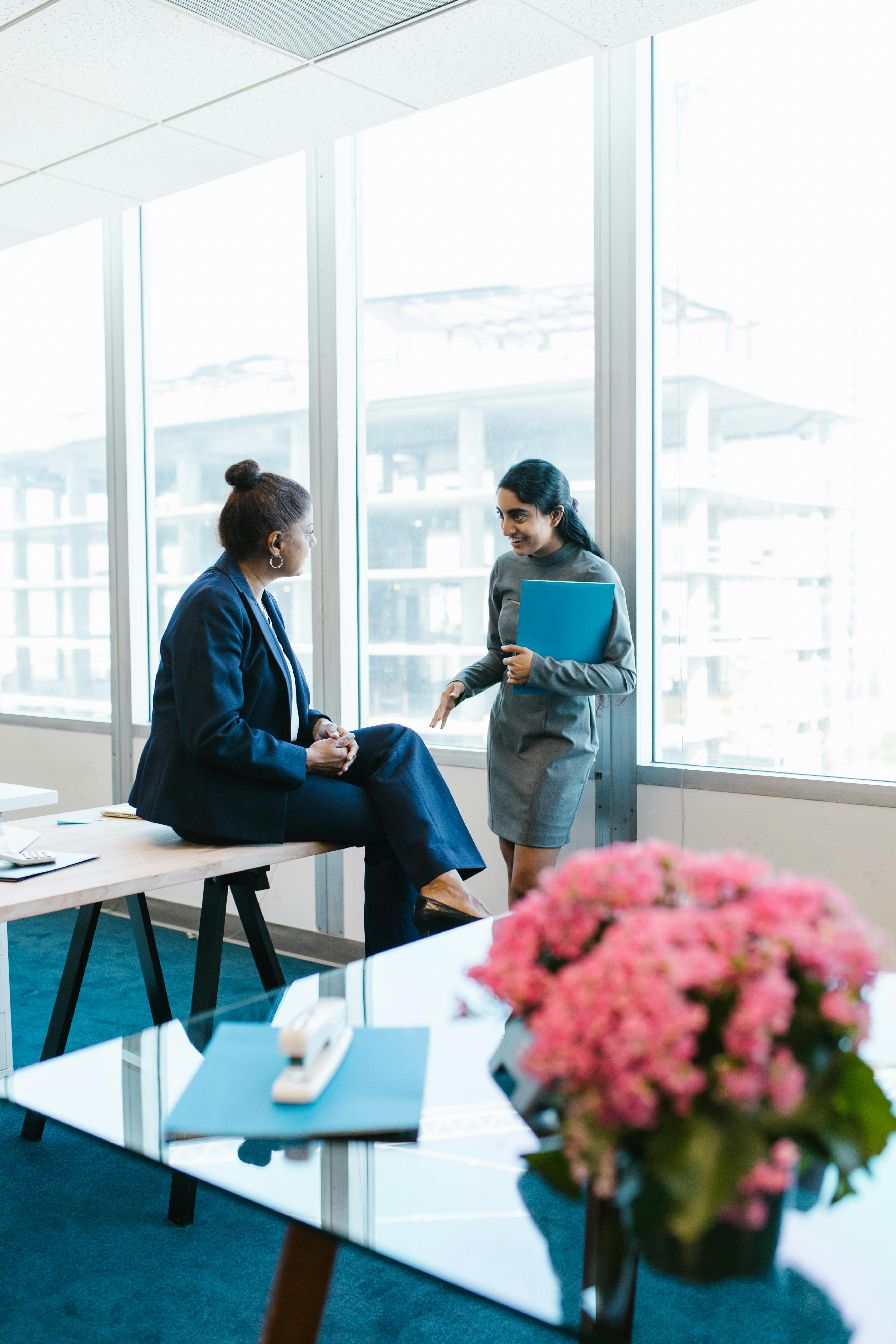 women talking in the office