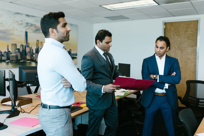 Engineers reviewing project documents