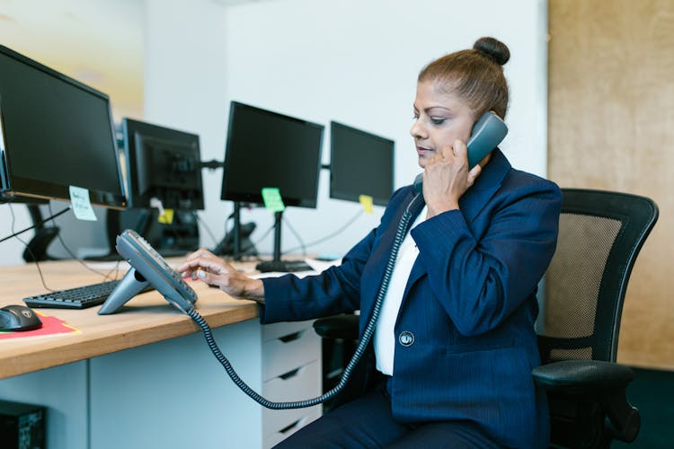 Woman Talking On The Telephone