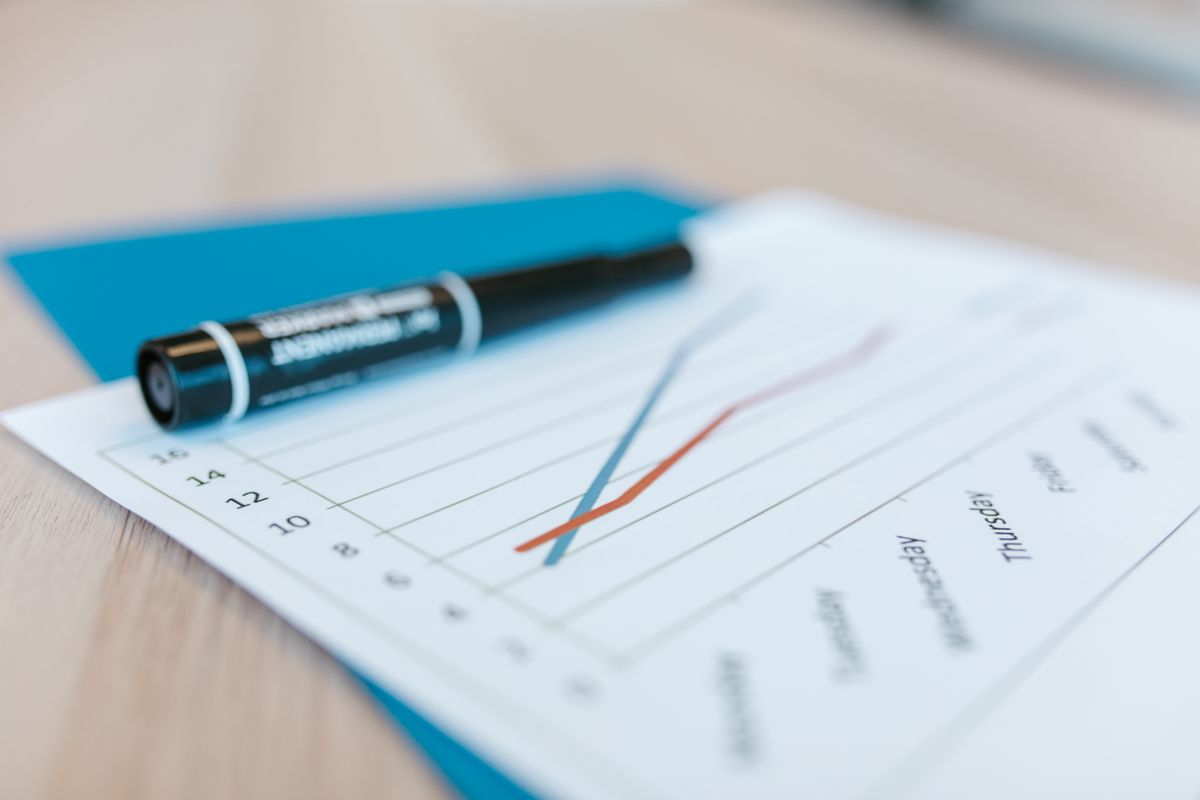 Family practice owner comparing marketing options at desk