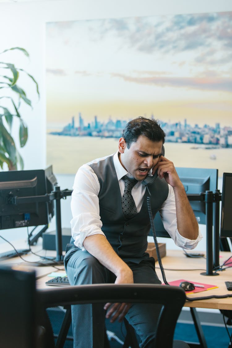 Man Talking On The Telephone