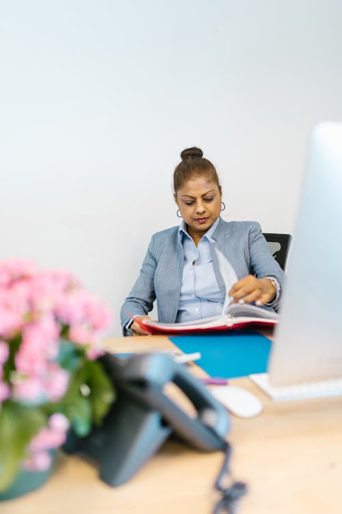 Woman Looking at the Documents