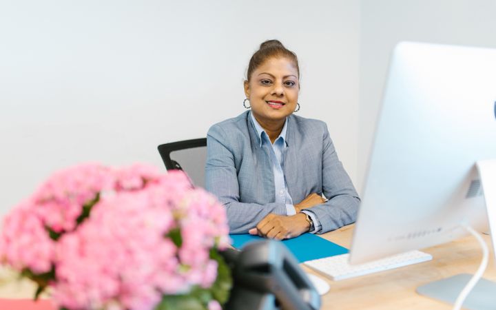 A professional at her desk in an office