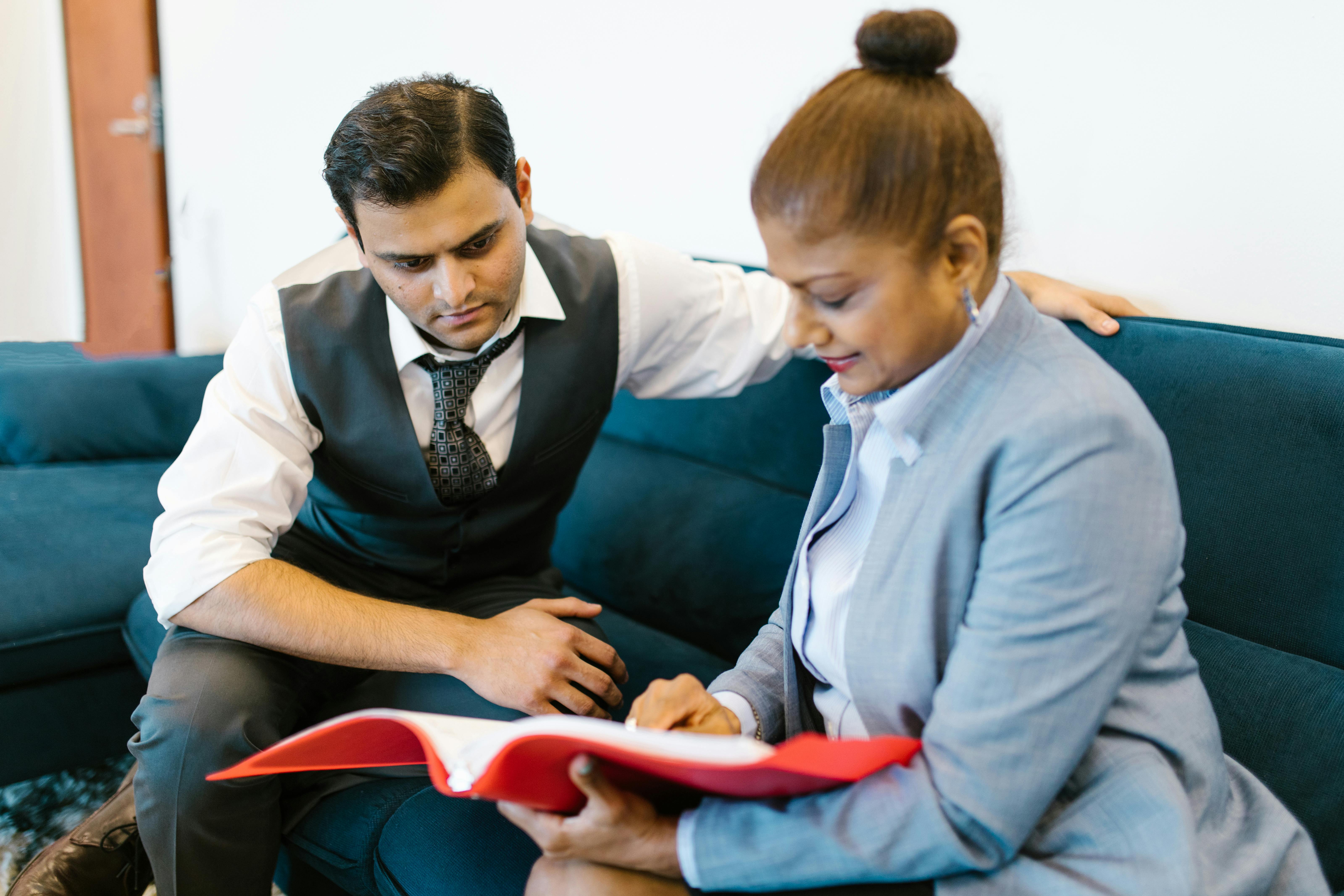 woman showing the documents to his officemate