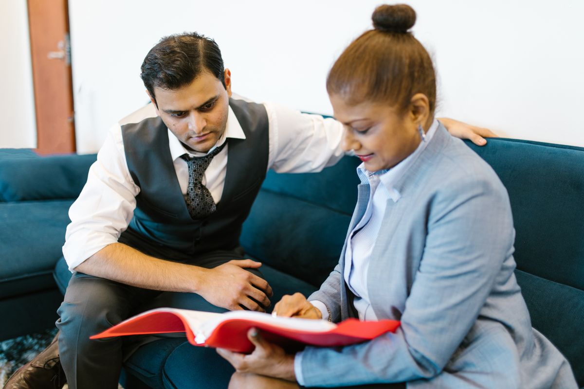 Business consultant reviewing plans with a client