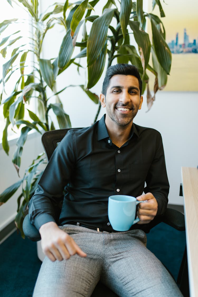 Man In Black Dress Shirt Holding Blue Ceramic Mug