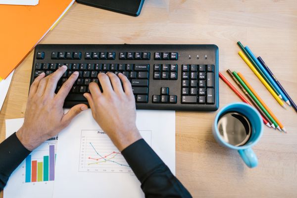 Overhead view of a desk and keyboard — photo by RDNE Stock project on Pexels