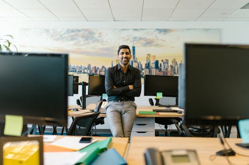 Woman in Black Long Sleeve Shirt Sitting on Black Chair