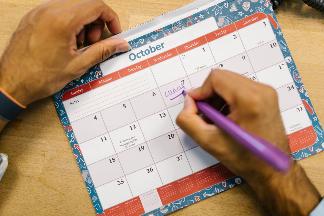 Calender Rditing Person Writing on a Calendar · Free Stock Photo