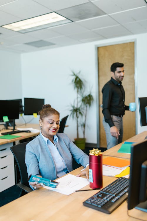 Man and Woman at an Office