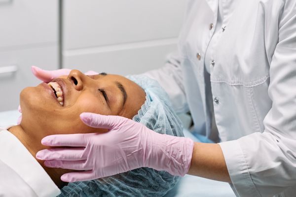 Woman receiving a relaxing facial treatment