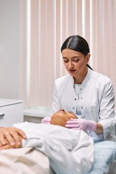 Beautician performing facial treatment in a spa setting, promoting relaxation and care.