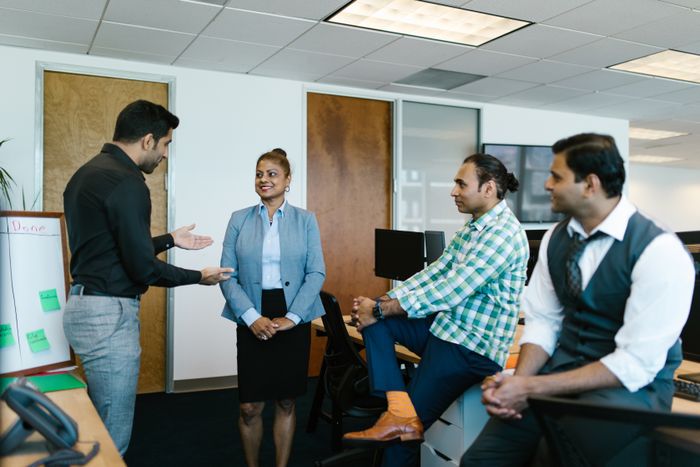 Indian marketing team collaborating in office