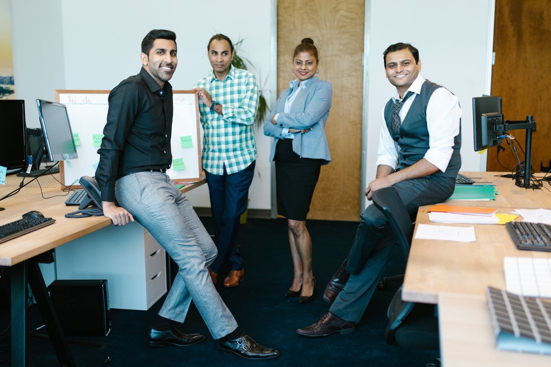 Indian marketing team standing together in an office