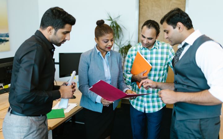 Colleagues going through a document together