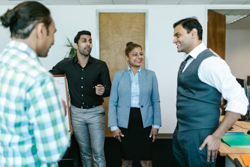 Man Wearing a Waistcoat Standing Beside a Woman 