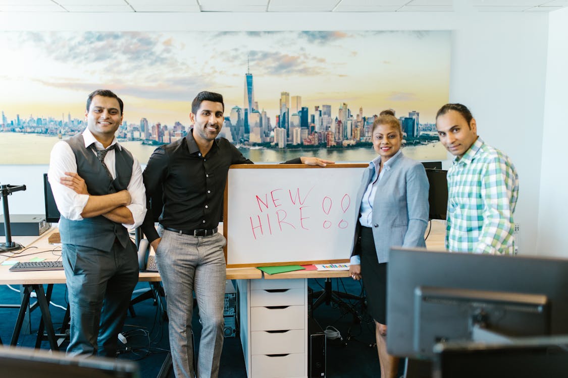 Free People Standing Beside a Whiteboard Stock Photo
