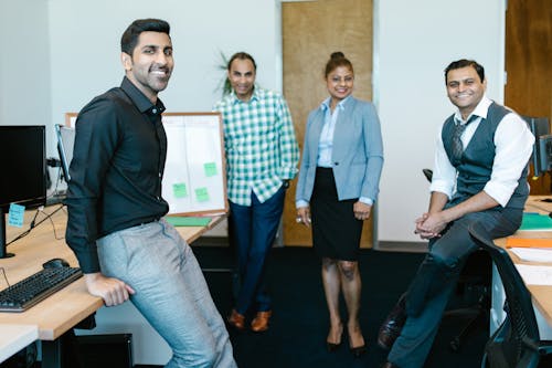 Free Group of People Standing Inside an Office Stock Photo