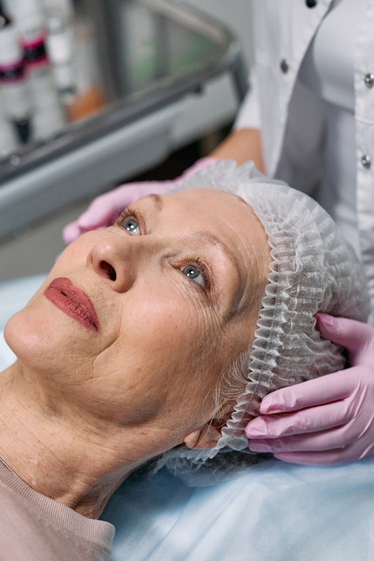 Woman Undergoing Treatment At A Botox Clinic