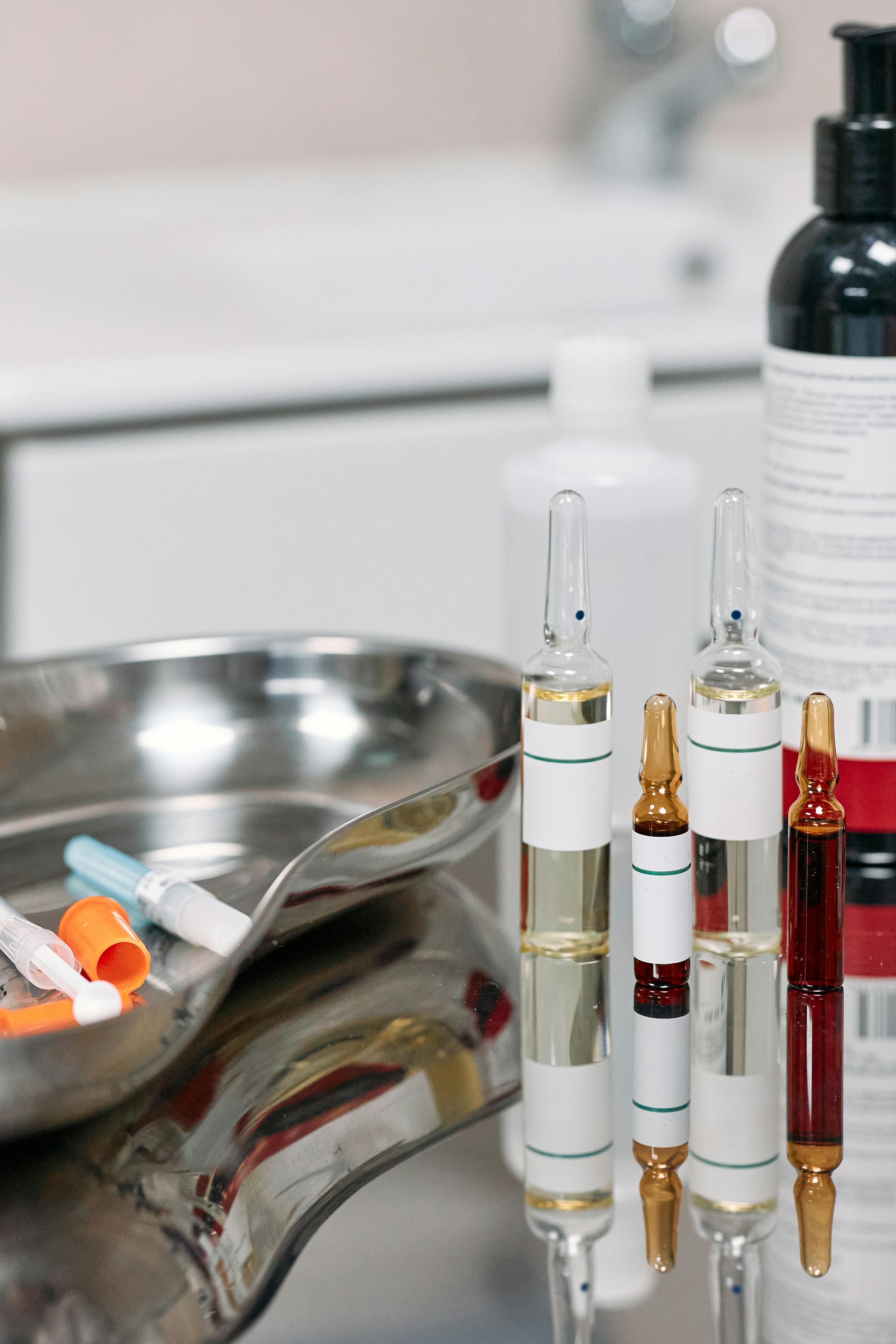 medical vials over stainless surface