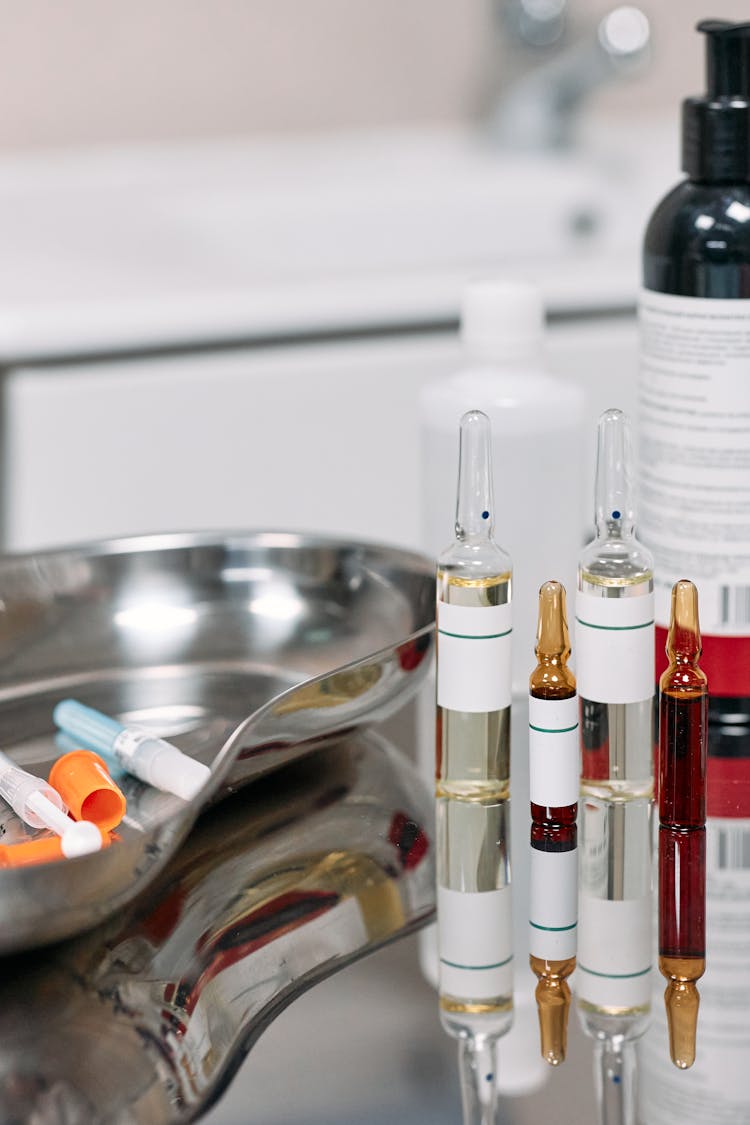 Medical Vials Over Stainless Surface