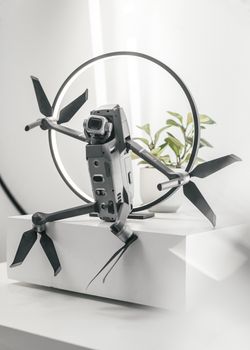 Close-up view of a futuristic drone with a ring backdrop, showcasing modern technology.