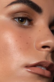 Detailed close-up of a woman's face highlighting natural beauty and skin texture.