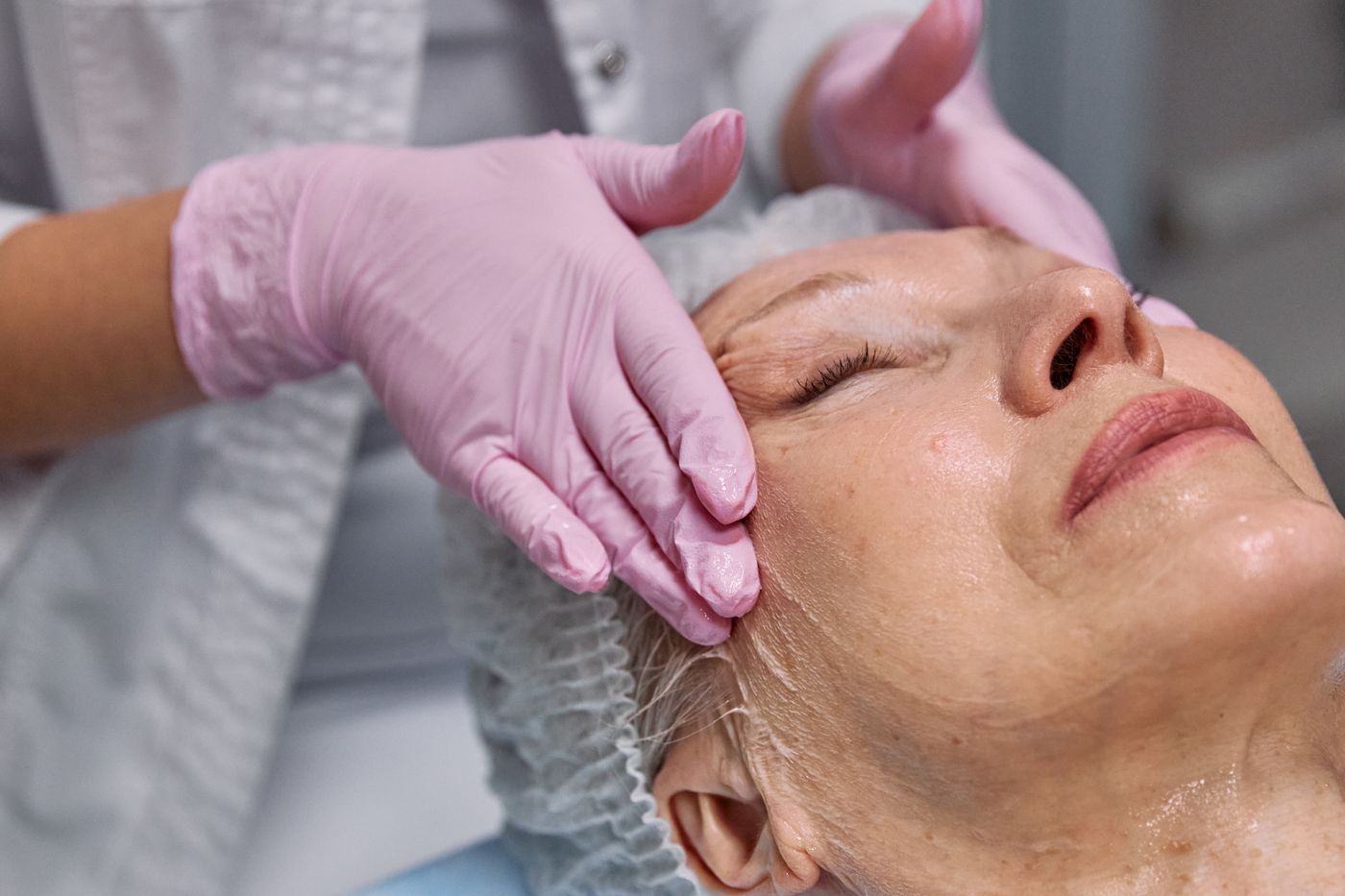 A client enjoying a relaxing facial massage.
