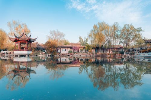 Free Serene autumn view of traditional Chinese pavilion and lake reflection in Montreal Botanical Garden. Stock Photo