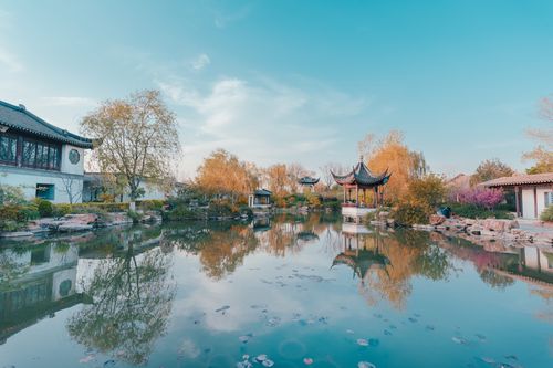 Free Beautiful autumn reflection of traditional Chinese pavilions in a serene garden pond in Suzhou. Stock Photo