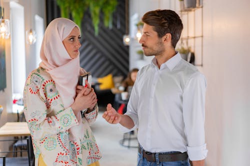 Free A Man Talking to a Woman inside the Coffee Shop Stock Photo