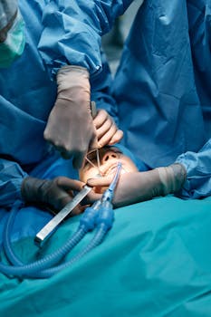 Surgeons performing a detailed surgical operation on a patient under anesthesia in an operating room.