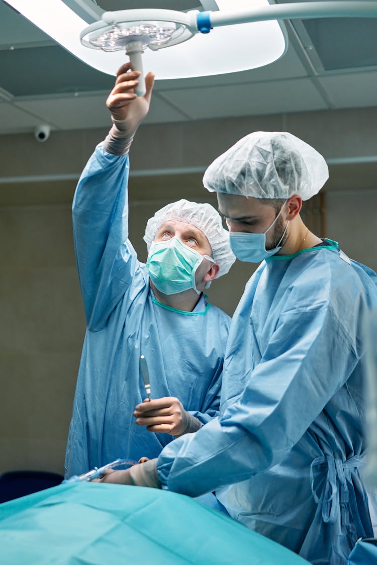 Surgeons Working On A Patient In An Operating Room